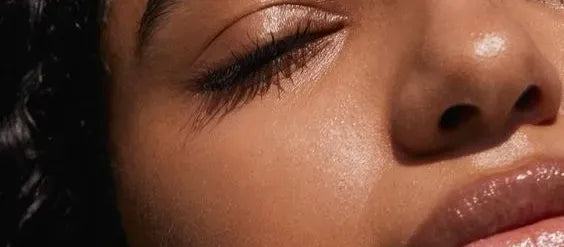 A woman applying sunscreen on her face, showcasing the best sunscreen options for women.