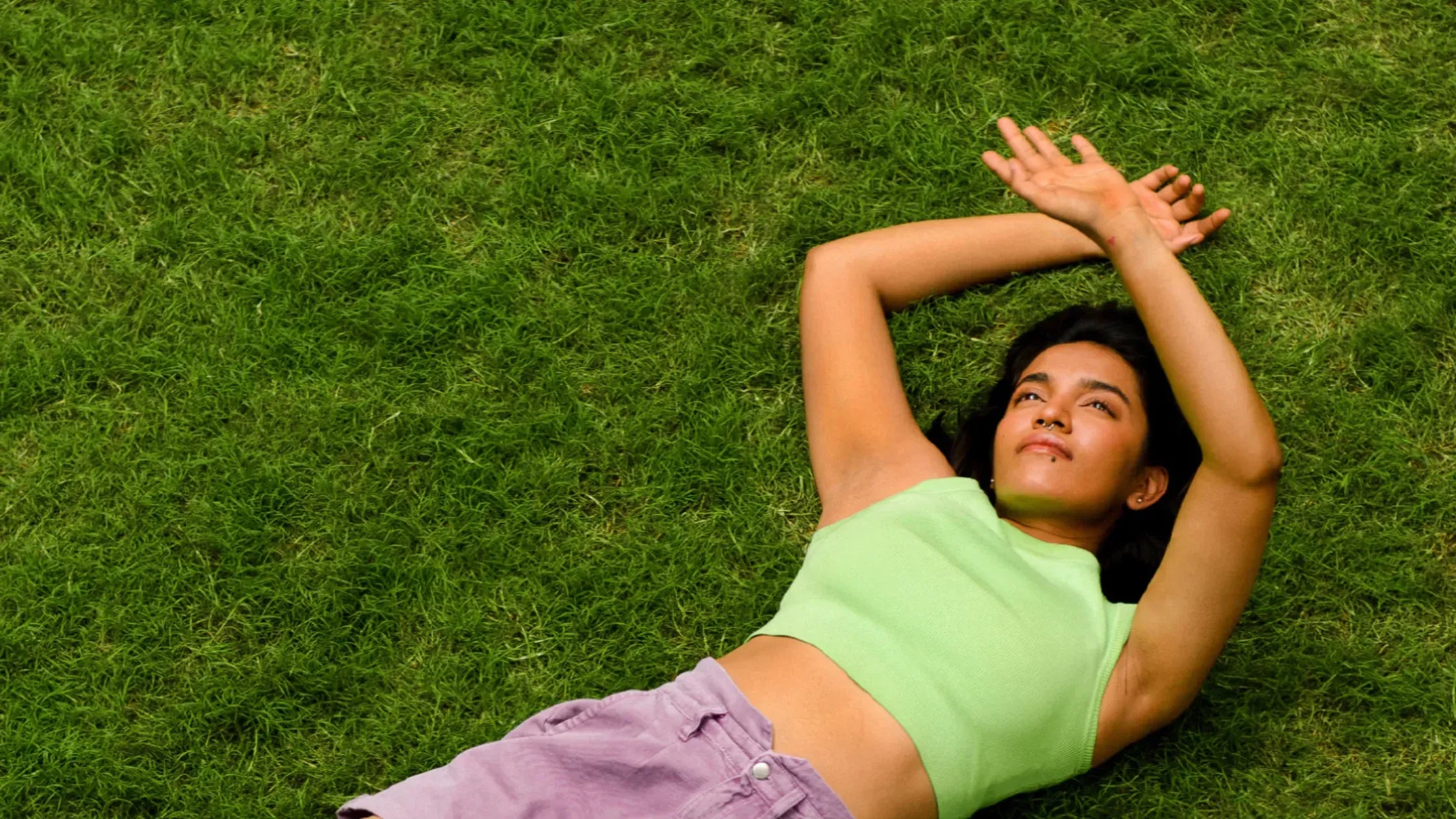 A selection of pigmentation face serums on a marble countertop.