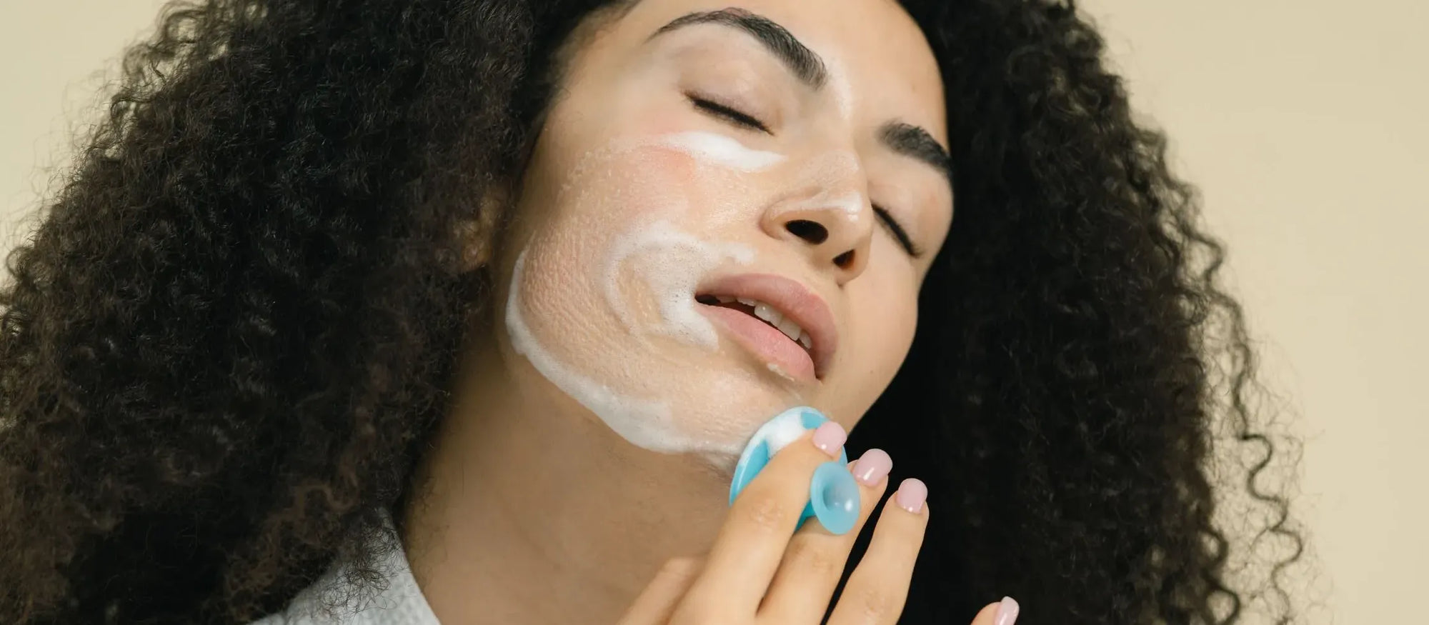 A selection of acne face washes displayed on a bathroom counter, showcasing various brands and formulations.