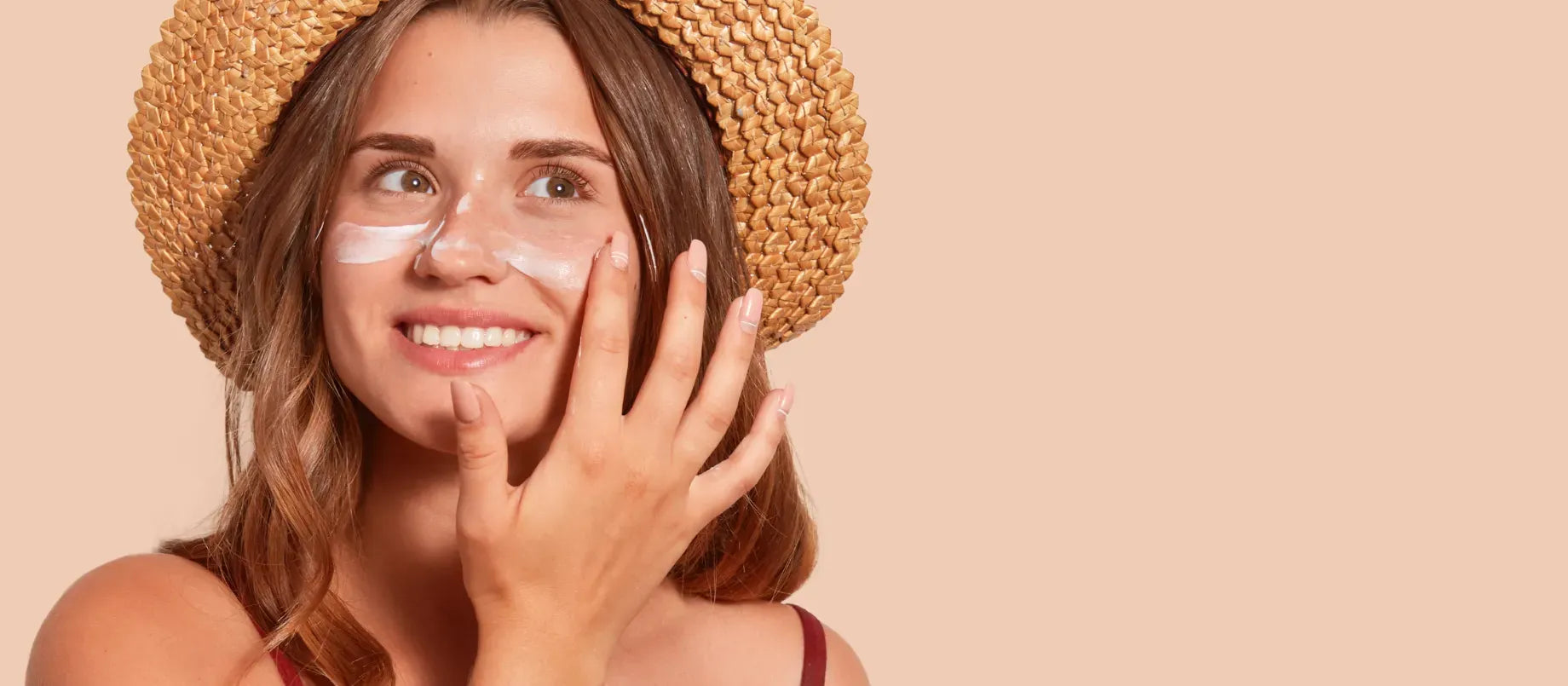 A woman applying SPF 50 sunscreen on her face, questioning its strength for daily use.