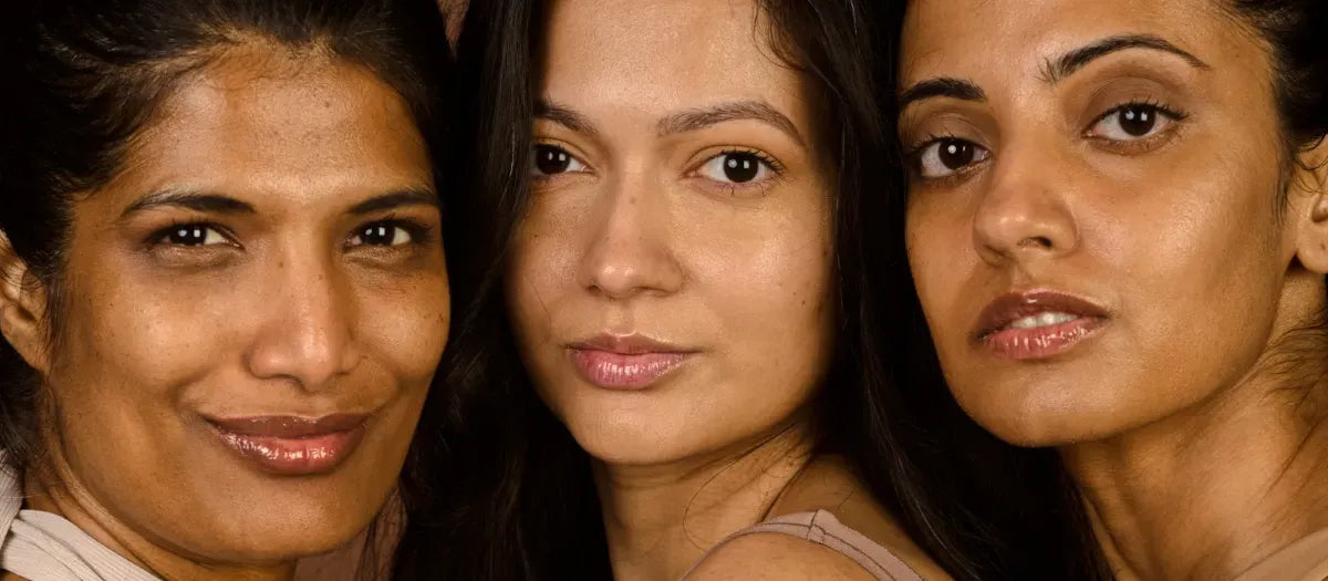 Close-up of a refreshing acne face wash bottle next to glowing skin, promoting radiant complexion and clear skin.