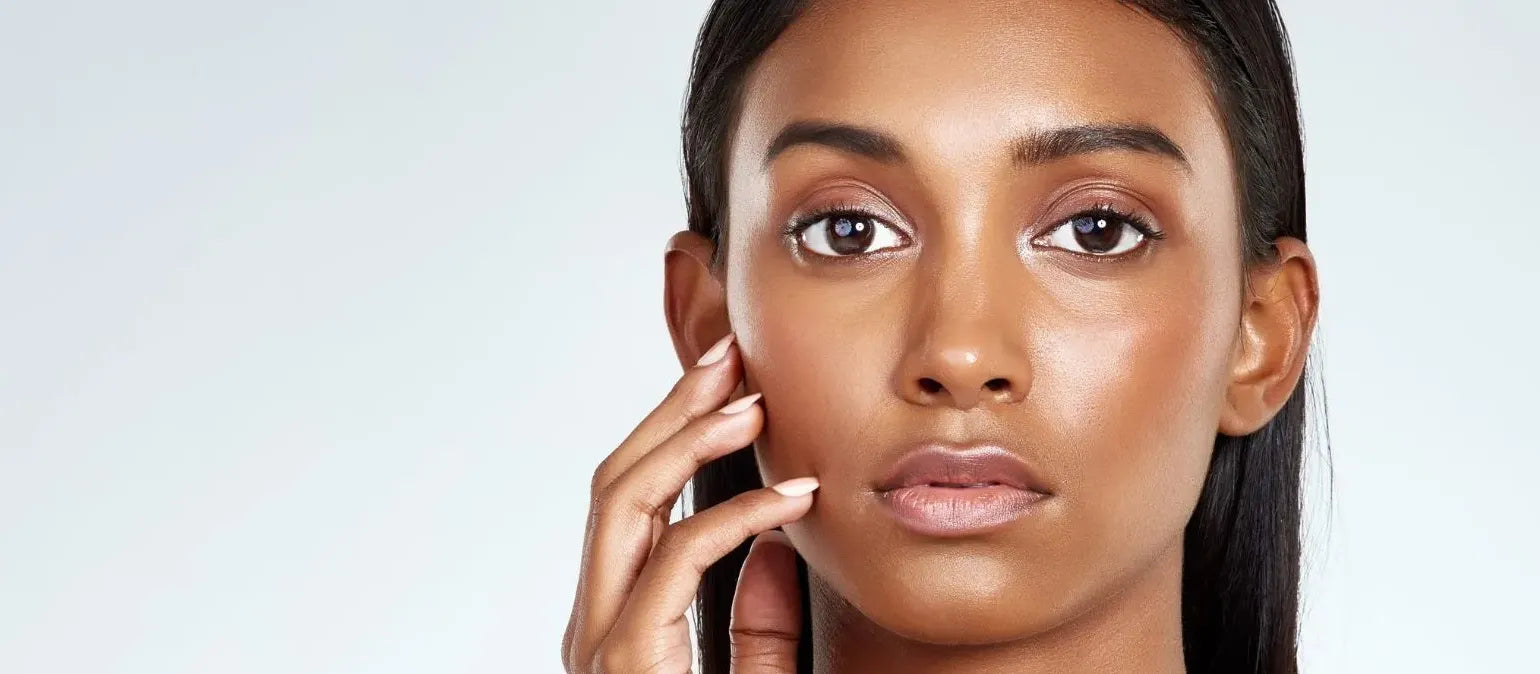 A woman applying effective creams to reduce pigmentation around her mouth, showcasing skincare routine.