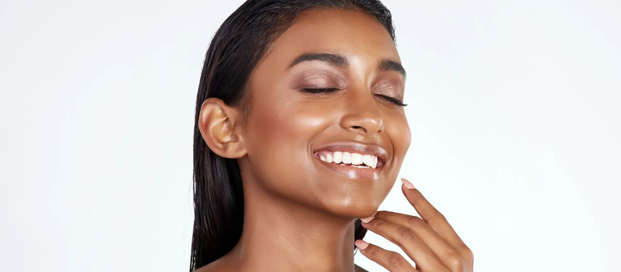 A selection of face serums designed to reduce pigmentation on diverse skin tones.