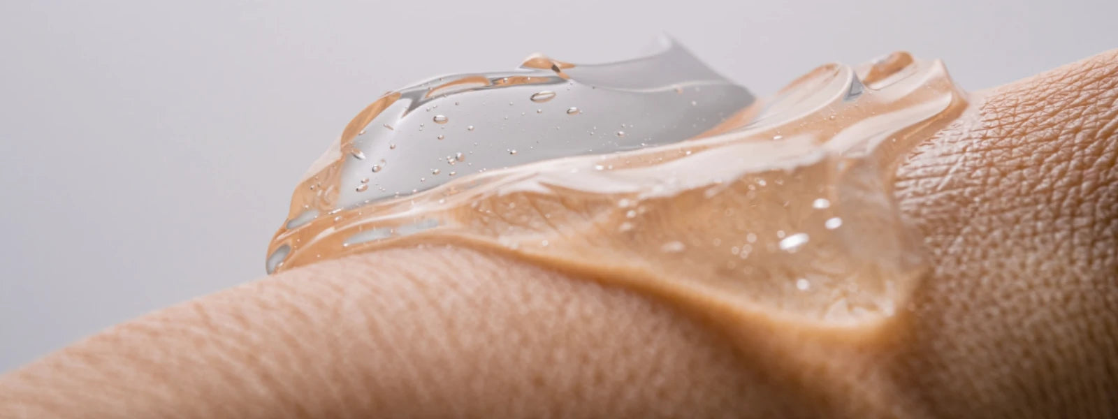 Split visual showing hydrated skin cells and oily skin pores, illustrating hydration vs oiliness. 