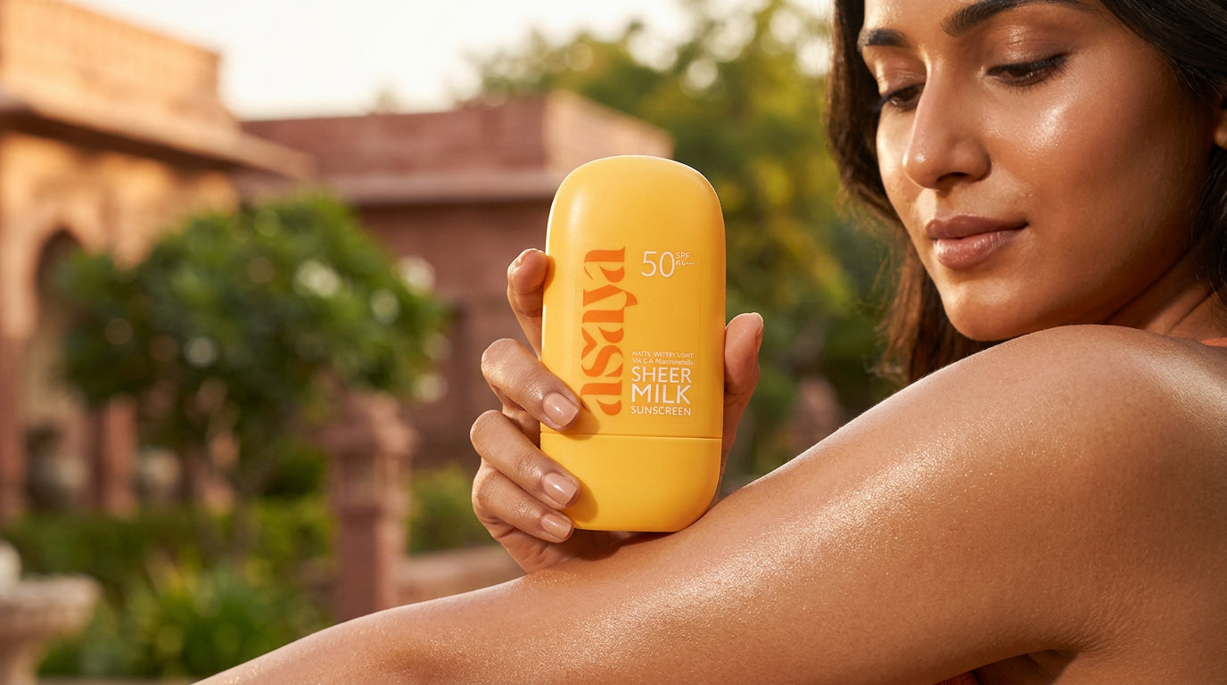 give an image of an Indian women delaing with Sheer Milk Sunscreen - SPF 50 Matte Fluid Sunscreen 