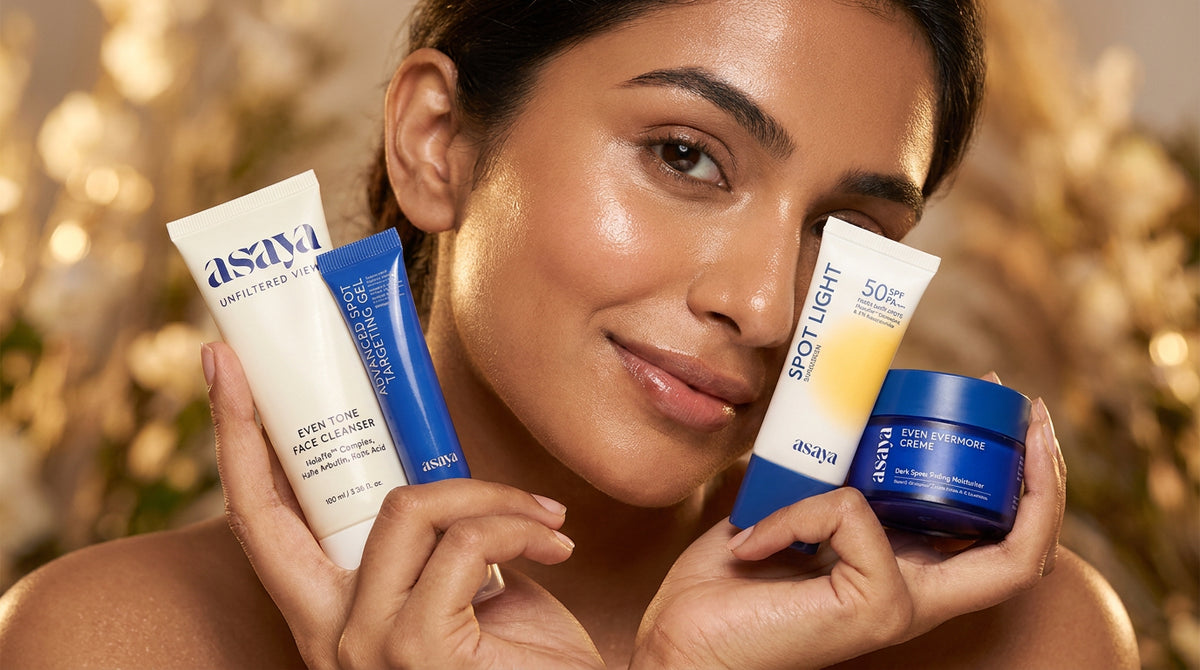 A close-up beauty portrait of a indian woman holding a skincare serum and moisturizer, glowing healthy skin, soft focus, luxury skincare campaign, high-end editorial photography. 